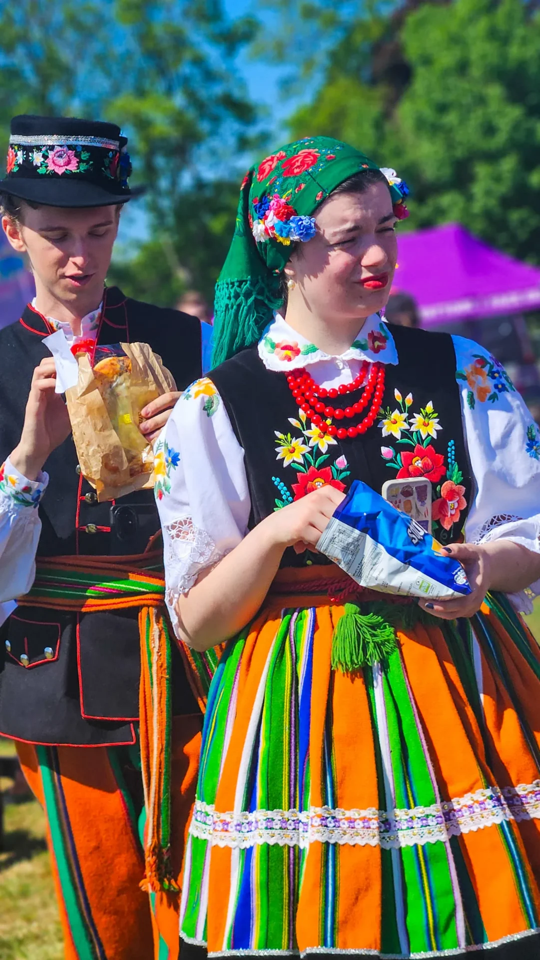 Young man and woman in traditional Polish outfits dancing the Polonaise at Polish Heritage Day 2025 in Hounslow, supported by RAD Removals’ movers West London and storage Ealing services.